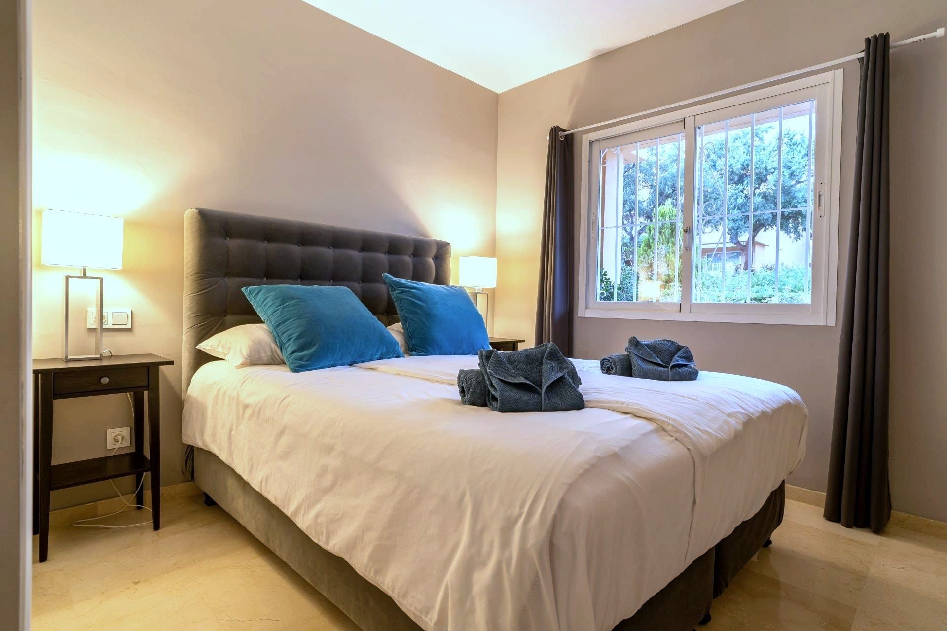 Main bedroom with a double bed and a window to the garden