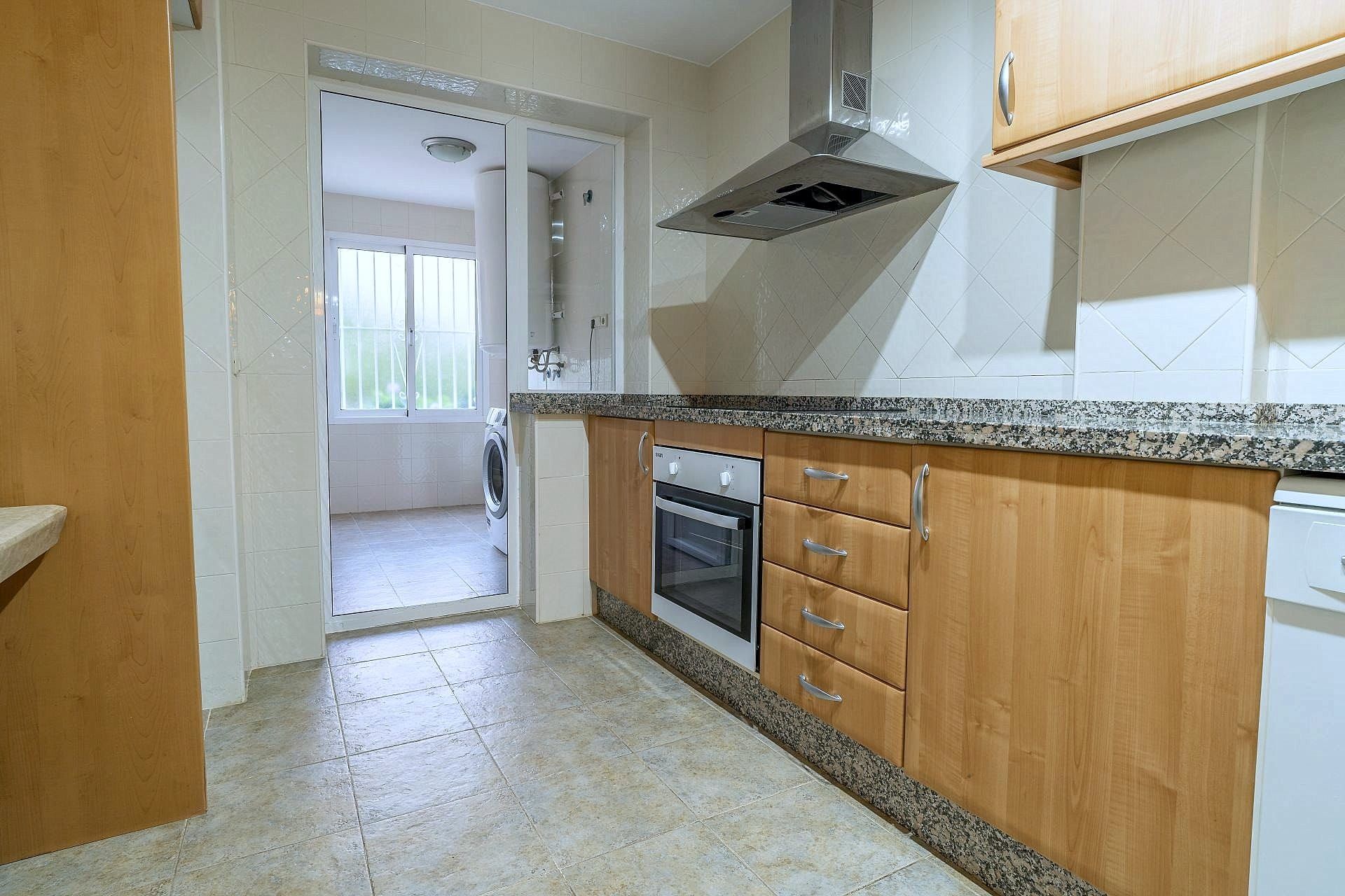 Kitchen with the separate laundry room