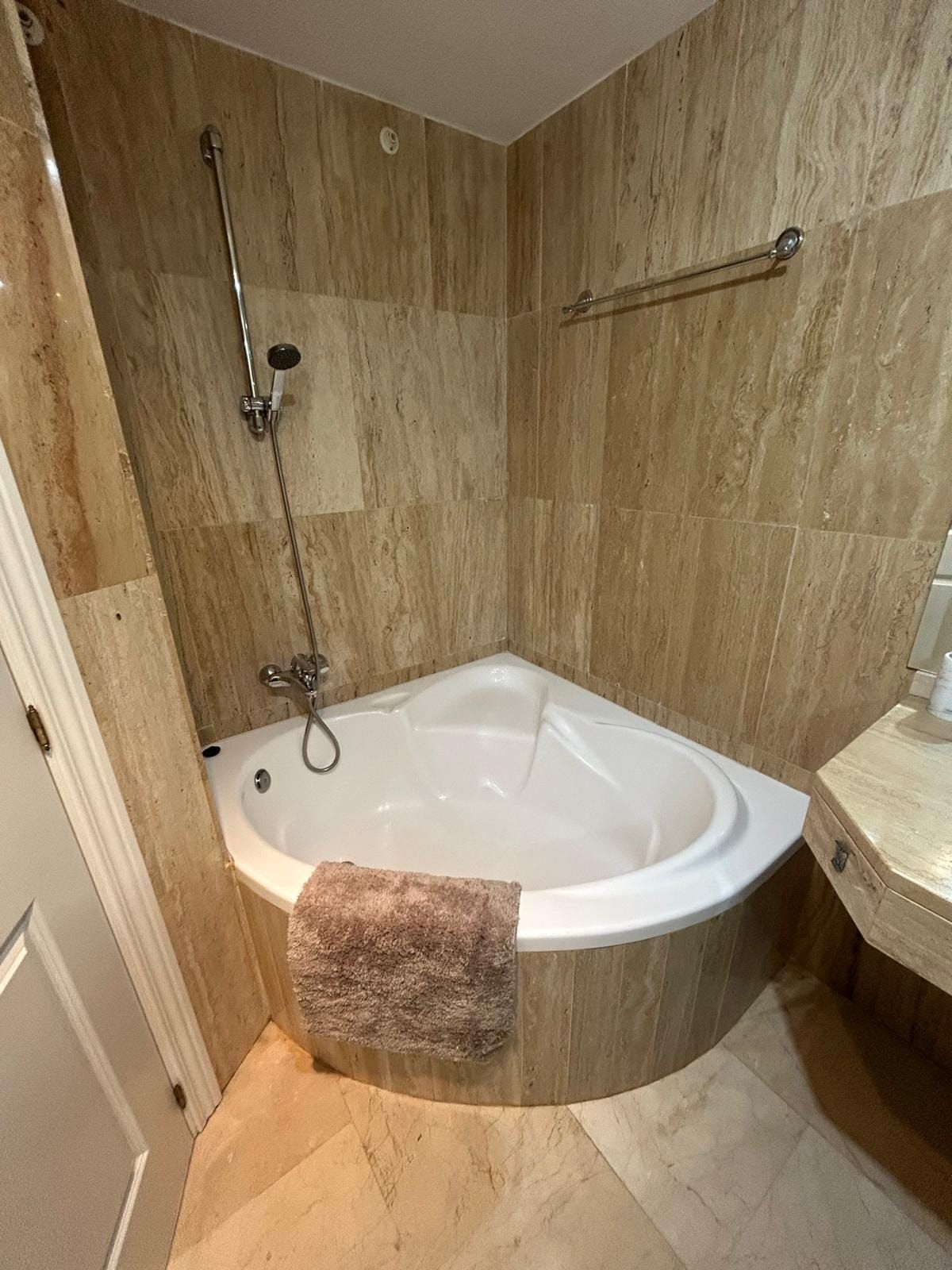 Corner bathtub with a shower