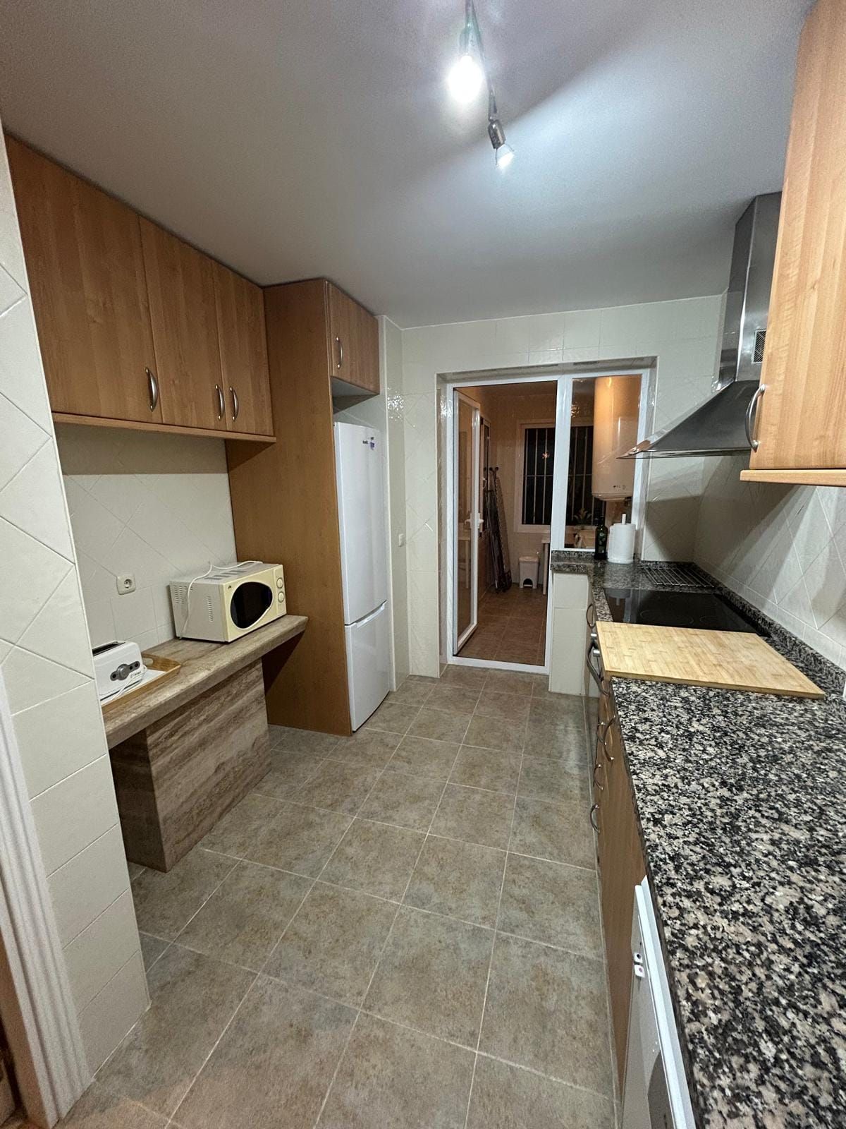 Kitchen with a view to the laundry room