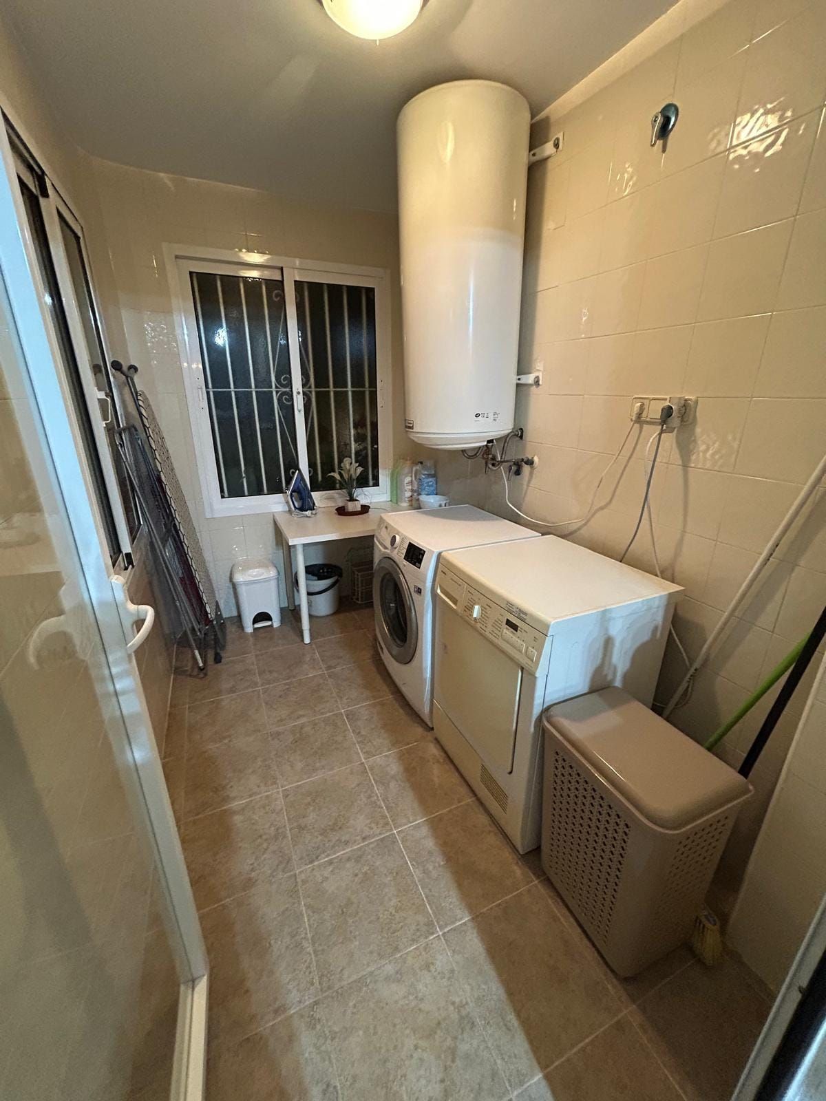 Separate laundry room with washer and dryer