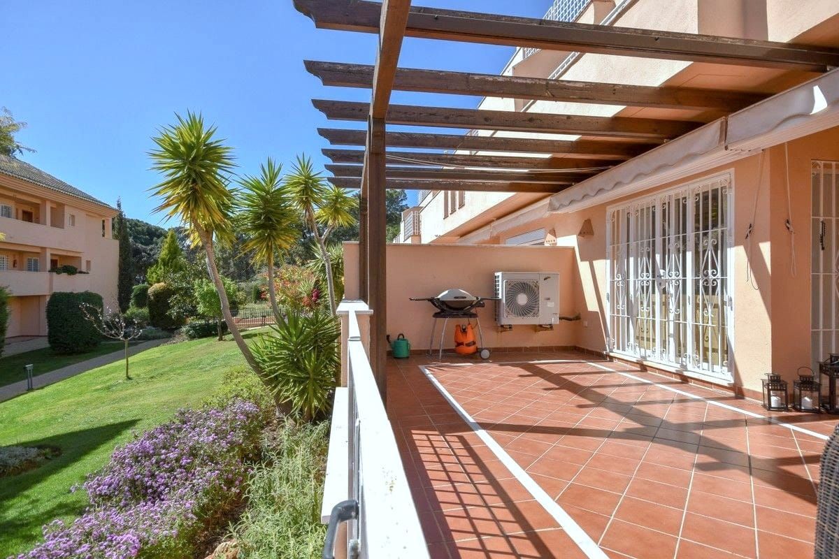 Terrace under the pergola facing the garden